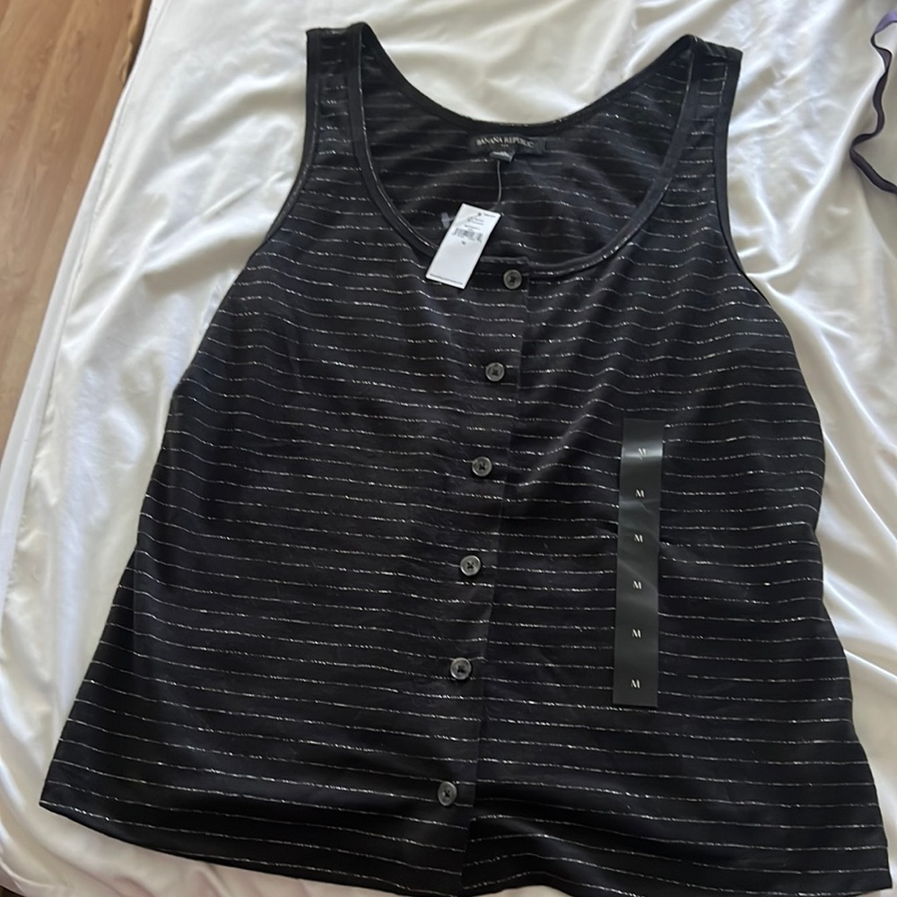 Never worn Tank. Size Medium